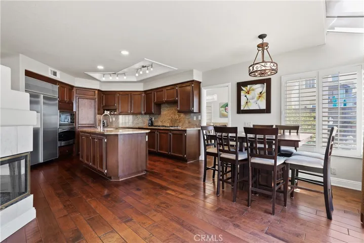 Upgraded cabinets with granite counters, pantry, convection mircrowave oven, stainless steel built-in refrigerator and cooktop stove