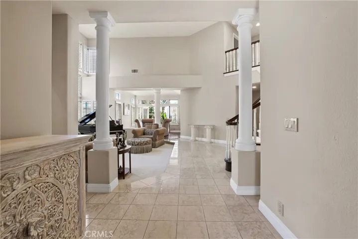 Marble Tiled Flooring and Pillars adorn the entry to bring you into an Exquisite Sanctuary to enjoy.