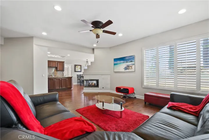 Family Room with Shutters, Ceiling Fans and Recessed Lighting