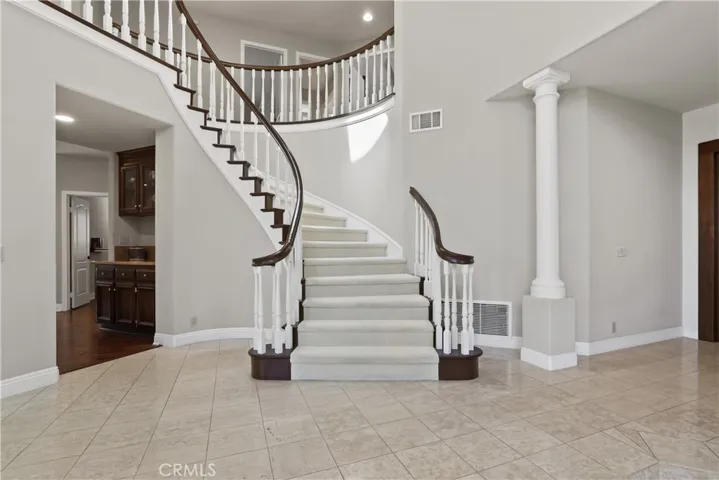 Grand Staircase accents the Spacious Entry