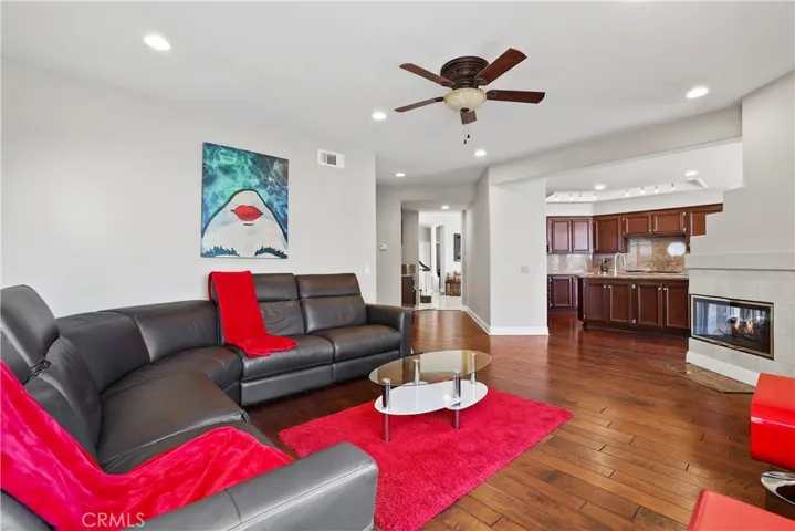 Open Family Room with 3-sided Fireplace to enjoy from Kitchen Area. Wetbar conveniently located to service both the living and family room areas