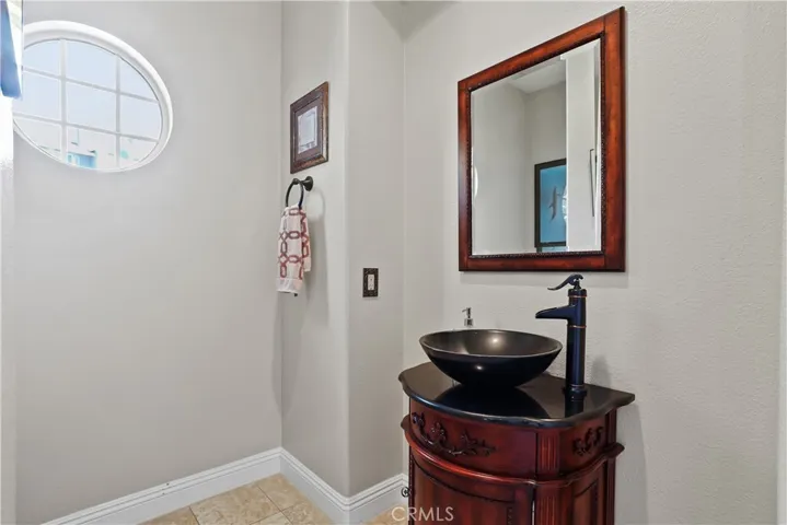 Guest Powder Room located adjacent to the entry