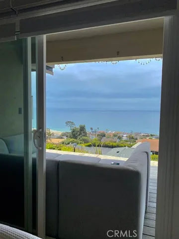 Living room sliding door opens directly to porch