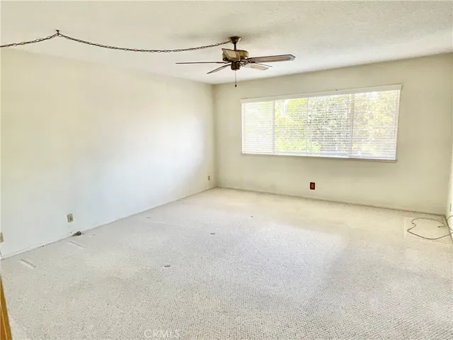 Spacious primary suite overlooks yard & assoc. greenbelt.