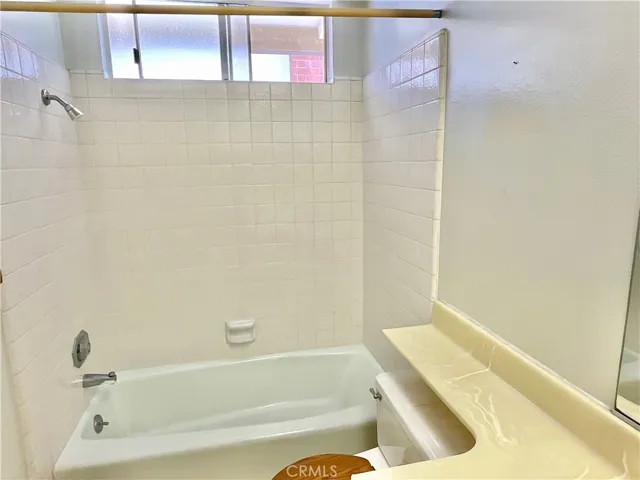 Upstairs hall bathroom has combo tub/shower.