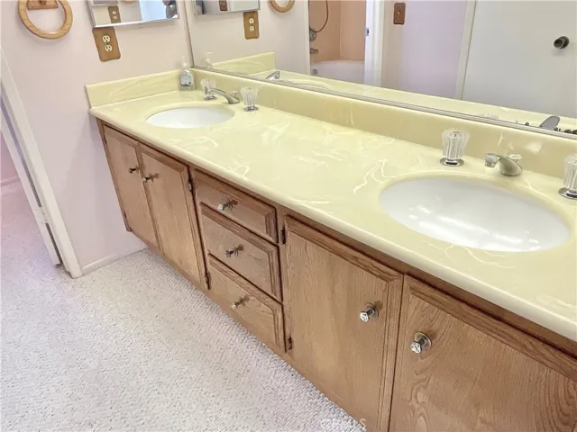 Primary bathroom has dual vanities.