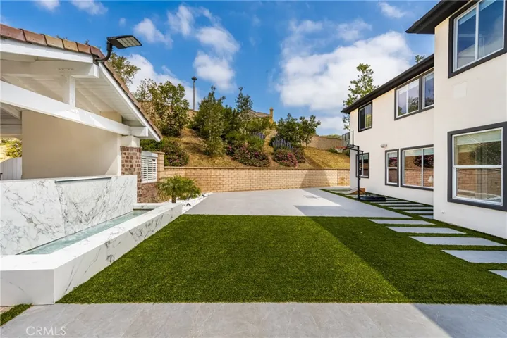 Outdoor waterfall and artificial turff