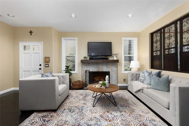 Beautiful living room with a fireplace and custom mantle.