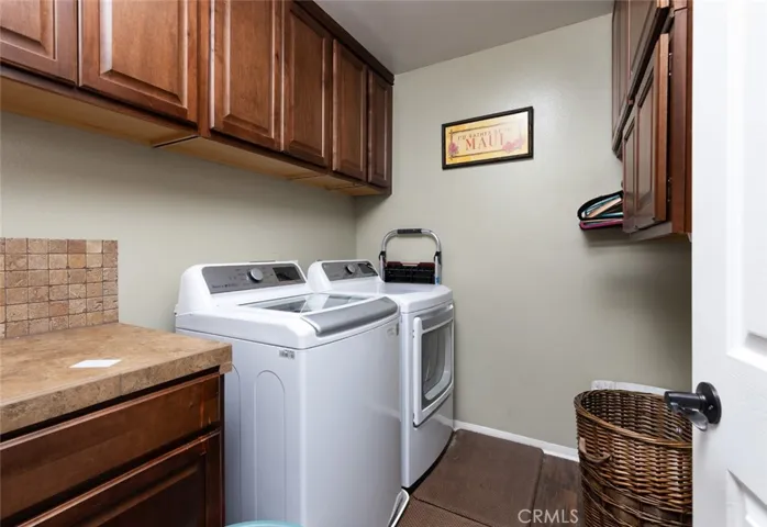 Laundry room located upstairs.