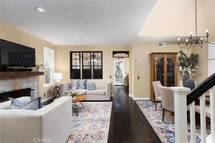 Meticulously upgraded home boasts stunning wood floors and open floor plan.
