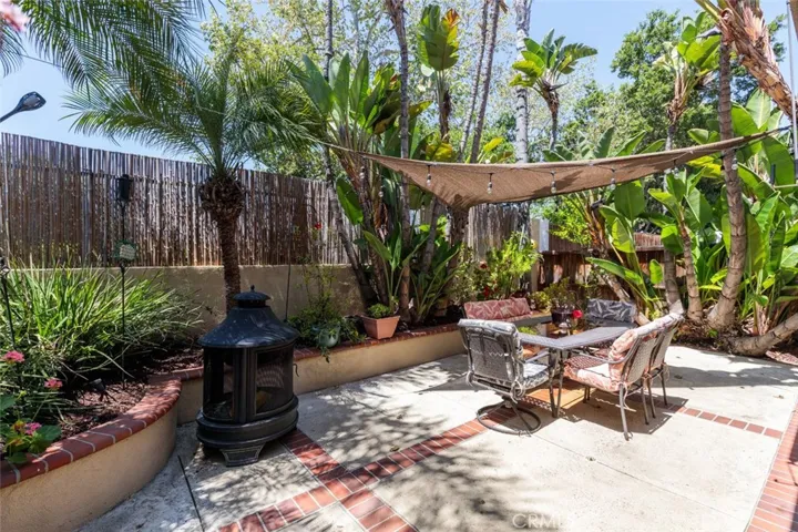 Backyard with lush landscaping and hardscape.