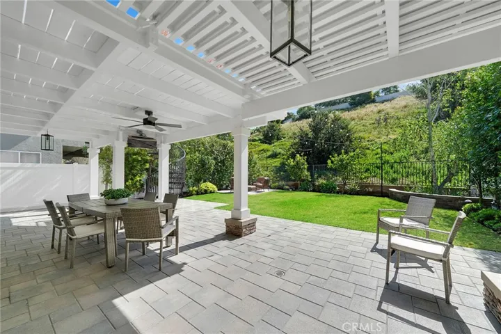 Downstairs covered patio has an infared heater and ceiling fan