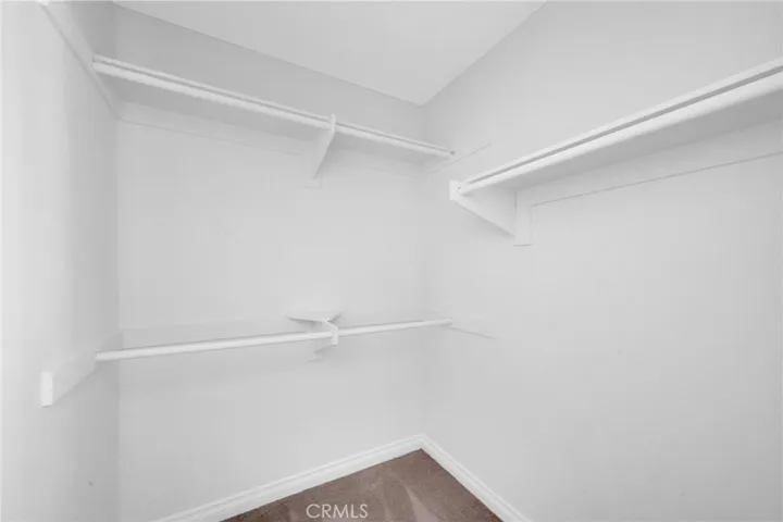 Walk-in closet in primary bedroom