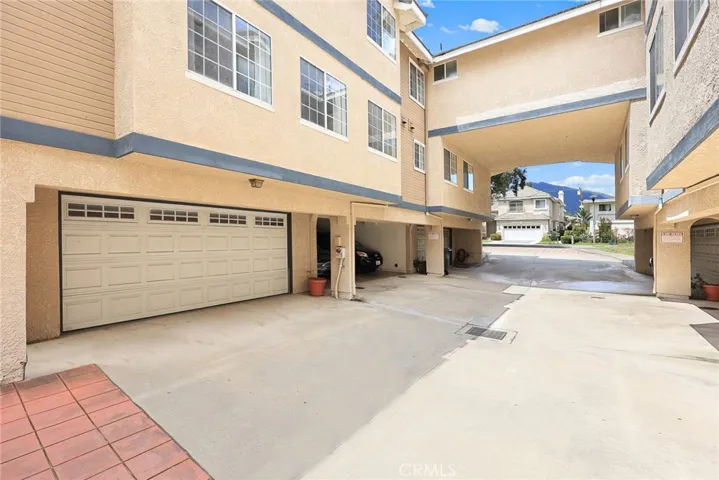 Outside view of the spacious two-car garage, adjacent to the guest parking