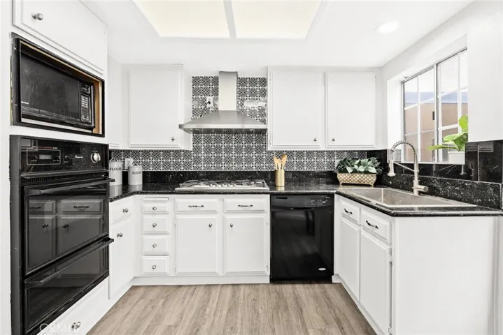 Decent-sized kitchen with a window, making it super bright & airy