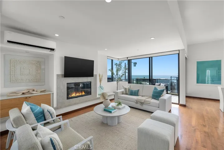 living room with fireplace and adjacent deck
