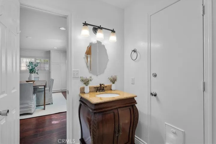 3/4 bath with access to the backyard - perfect for wet towels and swimsuits after pool time!