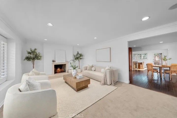 A spacious, bright and beautiful living room opens to kitchen