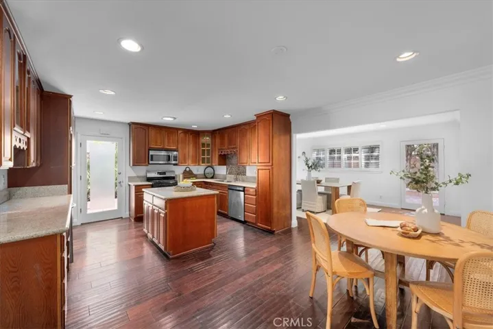 A spacious chef's kitchen with a breakfast area