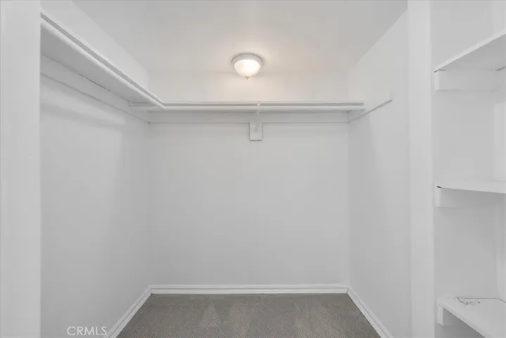 A walk-in closet out of two other closets