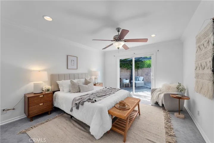 Primary Suite with 3 closets, en-suite bathroom with access to the pool and patio
