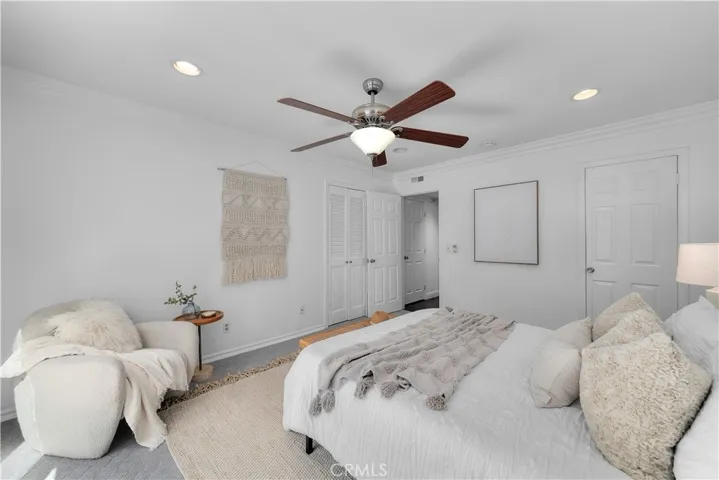 Primary suite with 3 closets, en-suite bathroom with access to the pool and patio