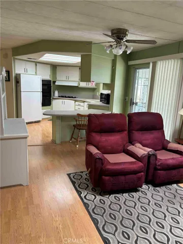 Family room to kitchen with glass doors to porch