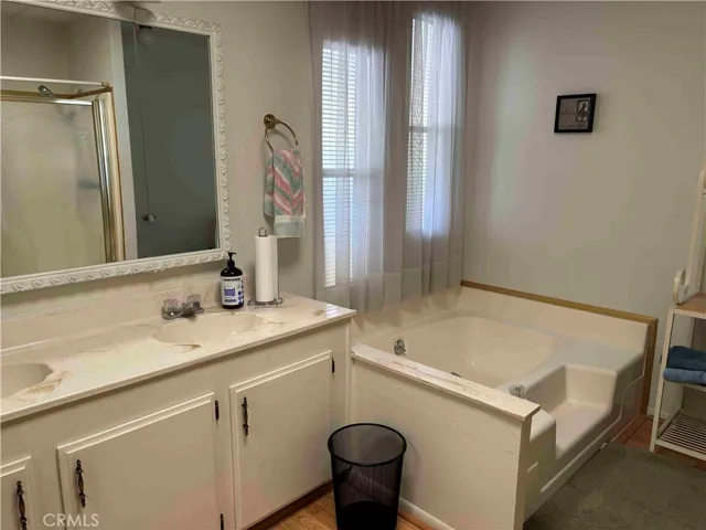 Primary Bathroom with dual sinks and tub