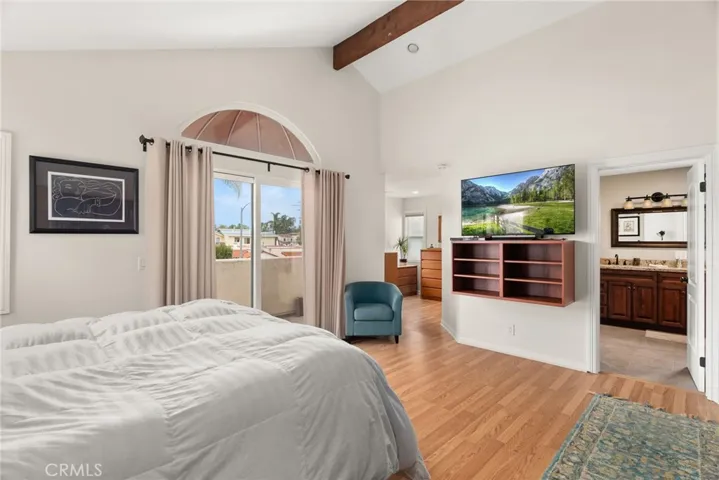 Primary Bedroom.  Sliding glass door leading to the balcony.