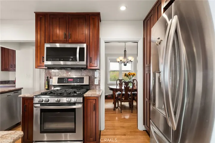 Beautiful range and microwave area.