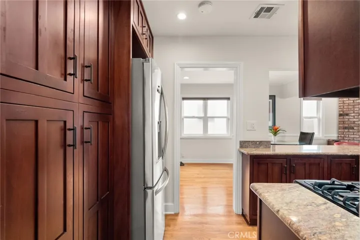 Kitchen cabinets and refrigerator.