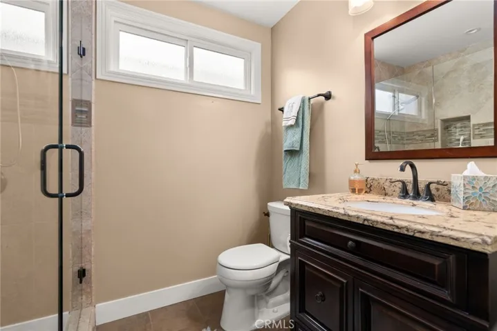 Guest bath, first floor.  Granite counter and top sink area.