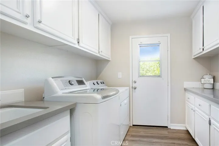 Inside laundry with sink and outside access