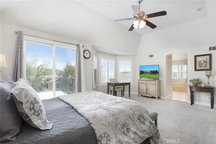 Primary bedroom with walk out deck