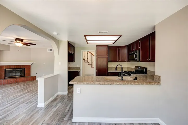 Open floor plan offers a view from breakfast nook of the kitchen and family room