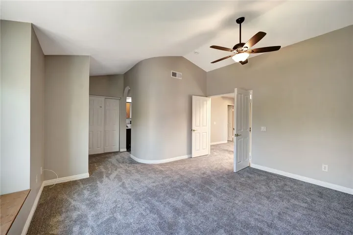 View toward primary bedroom double door entry from Window seat