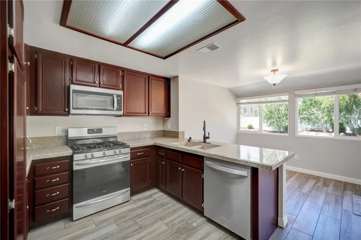 Upgraded kitchen is designed for easy use and with room for conversations