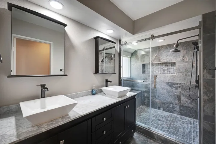Primary Bath features a large vanity with double sinks