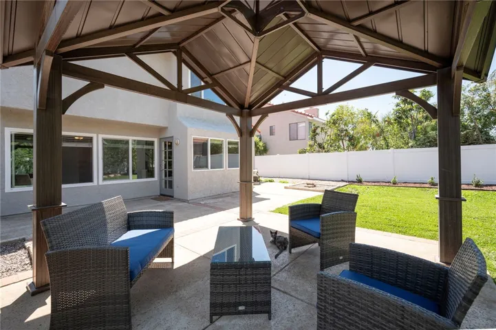 Custom gazabo in the back yard away from the house for a second outside sitting area
