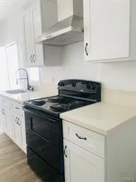 ADU Kitchen with white Shake Cabinets and White Quartz Counters
