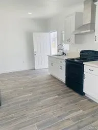 ADU Kitchen with white Shake Cabinets and white Quartz counters