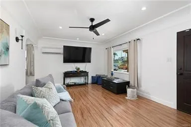 Living Room with Wood Flooring and Front Large Window