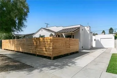 Front of Property with Privacy Fence & Long Driveway to Back ADU Unit