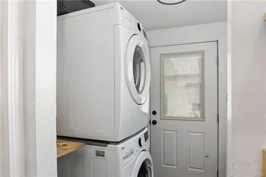 Laundry Area off Kitchen with Access to Backyard