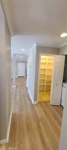 Walk-in pantry, adjacent to laundry closet and half bath.