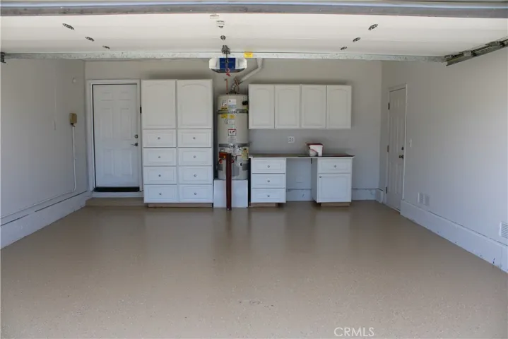 Finished two-car garage with built-in cabinetry and new epoxy flooring.