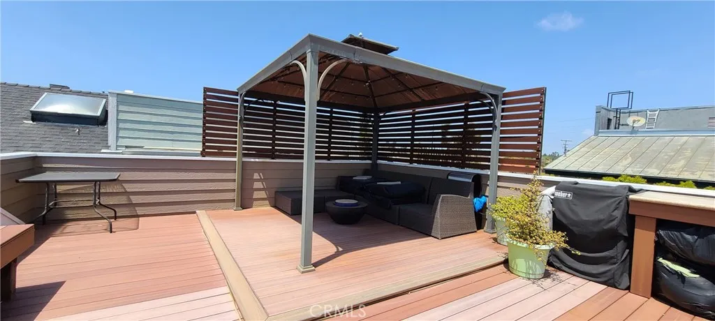 Upper view deck with comfortable, covered seating area.