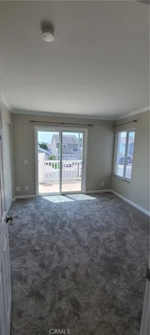 Second bedroom with sliding door access to front balcony.