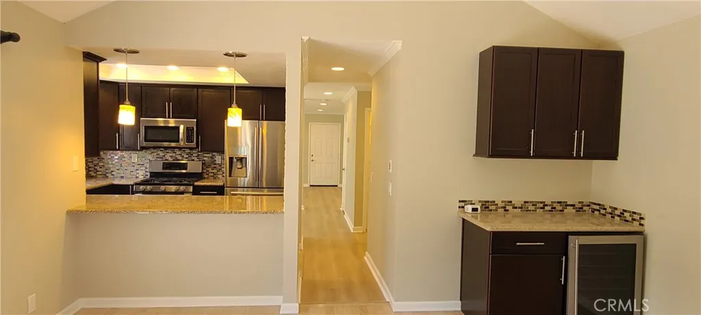 Family room, adjacent to the kitchen with breakfast bar seating.