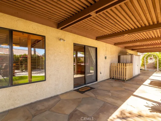 Backyard patio with sliding glass door